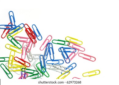 Close-up of multi-colored paper clips on a white background