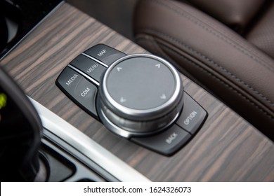 Closeup Of Multimedia System Control Buttons On A Wood Panel In A Modern Premium Luxury Car. Close-up, Soft Focus.