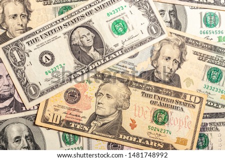 Close-up of multiple American dollar banknotes.