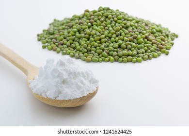 Close-up Of Mung Bean Starch Flour Powder In Wooden Spoon With White Background Isolated