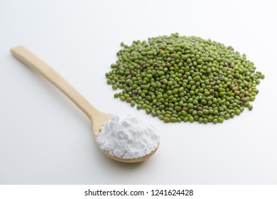 Close-up Of Mung Bean Starch Flour Powder In Wooden Spoon With White Background Isolated