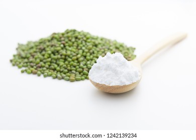 Close-up Of Mung Bean Starch Flour Powder In Wooden Spoon With White Background Isolated