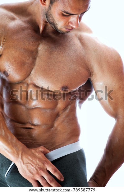 Shirtless Bodybuilder Posing With Crossed Arms. Stock 