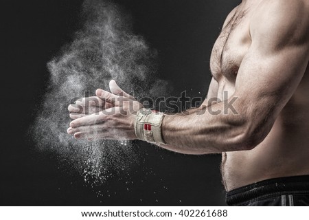 Closeup of a muscular  man ready to workout. Concept image.