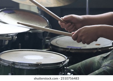 Close-up of musician playing drums on stage Selectable focus - Powered by Shutterstock