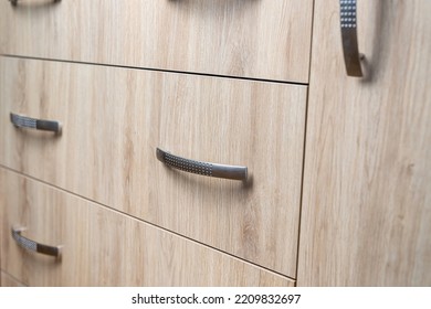 Closeup Of Natural Wooden Wardrobe Drawer Front With Handle, Background