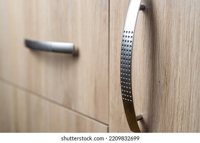 Closeup Of Natural Wooden Wardrobe Drawer Front With Handle, Background