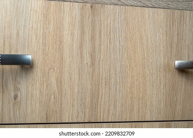 Closeup Of Natural Wooden Wardrobe Drawer Front With Handle, Background