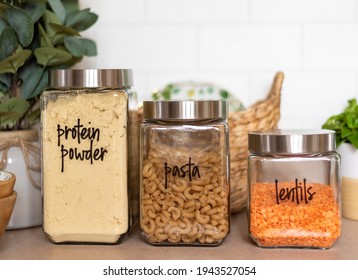 Closeup Of Neatly Organized Kitchen Pantry With Labeled Glass Canisters