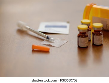 Closeup Of Needle And Vials - Preparing To Inject Vitamin B12