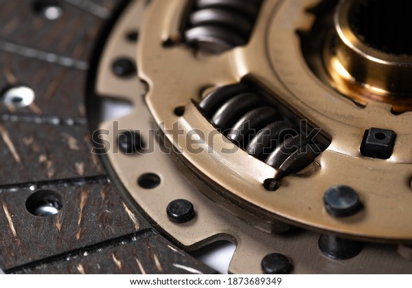 Close-up of a new auto clutch disc. Spare parts
for car maintenance and
service
