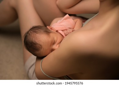 Close-up Of Newborn Baby Being Milked By A Young Mother, Top View