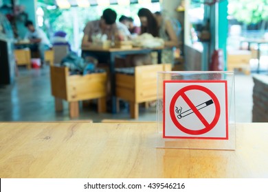 Close-up Of No Smoking Warning On Table In Coffee Shop Or Restaurant.