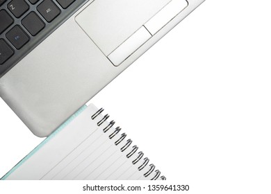Close-up notebook computer and book white background,top view.