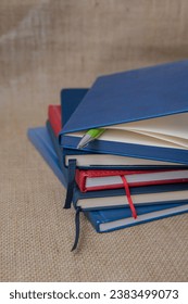 Close-up, notebook and textbooks on table, education concept. a ctack of notebooks folded on the table