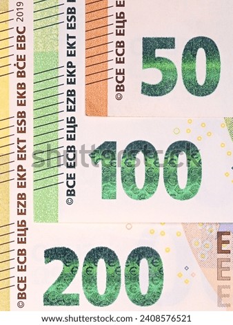 Close-up of the numbers corresponding to the value of 350.00 euros in banknotes of 50.00 euros, 100.00 euros and 200.00 euros each