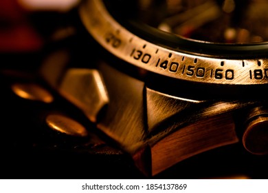 Close-up of the numbers on the outer ring of a watch. Selective focus, shallow depth of field.