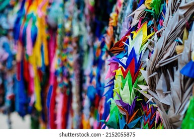 A Closeup Of Numerous Colorful Origami Paper Cranes