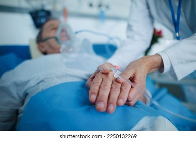 Close-up of nurse applying cannula at patients hand. - Powered by Shutterstock