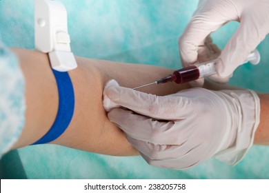 Close-up Of Nurse Taking Blood Sample