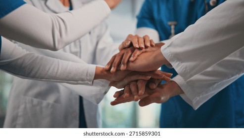 Closeup, nurses and doctors with handstack in hospital for celebration, surgery success and victory. People, healthcare workers and huddle for medical milestone, staff motivation and team achievement