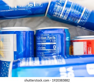 Closeup Nutrition Facts Information On Club Soda Can, Zero Percent Calories For Daily Serving Size, Depth Of Field. Carbonated Water In A Blue Package. Containers Compartment For Recycling.