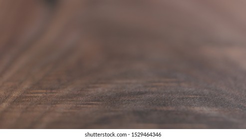 closeup of oil finished black walnut wood surface