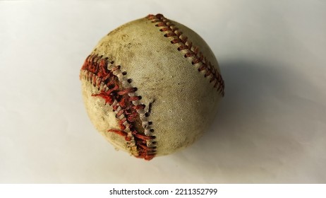 Close-up Of An Old Baseball Ball, On A White Background