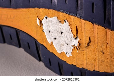 Closeup Old Broken Shoe Sole. The Sole Of Shoes In Image Has Badly Worn Out And Have Some Holes.