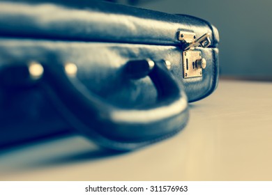 Closeup Of An Old Brown Shabby Brief Case Being Opened .