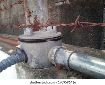 Closeup - Old Cable Box On The Background Of The Cement Wall.