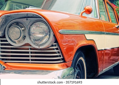 Closeup of old car with orange colored paint on automobile show - Powered by Shutterstock