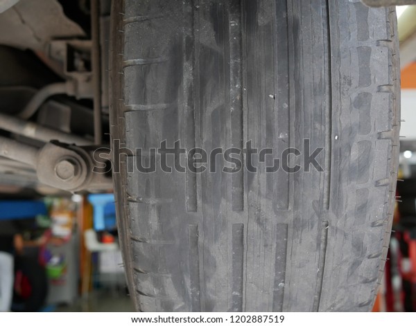 closeup of old\
car tires texture at the tyre\
shop.