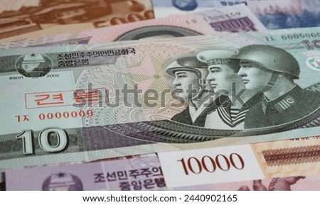 Closeup of old currency North Korean Won banknote - War economy and military armament compensation expenditure financing concept