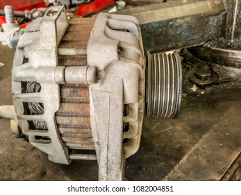 closeup of an old and dusty and rusty car dynamo - Shutterstock ID 1082004851