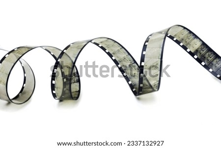 Close-up of an old eight mm film on an isolated white background