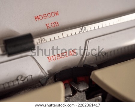 A close-up of an old electric typewriter with the words 