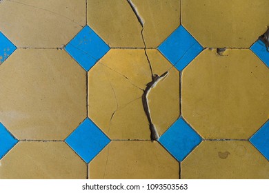 Close-up of an old floor tile with a two-tone pattern. Chapped floor tiles - Powered by Shutterstock