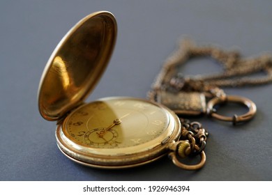 Close-up of old gold-plated pocket watch