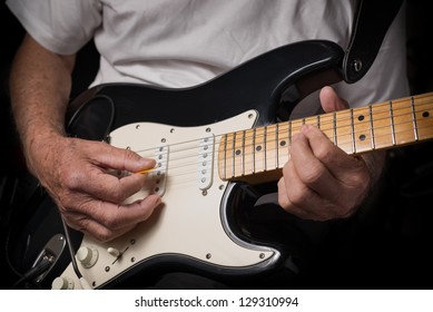 Closeup Of Old Guitar Player Playing An Electric Guitar.