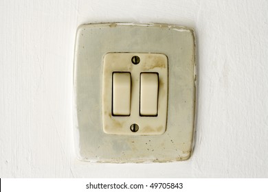 A closeup in a old light switch