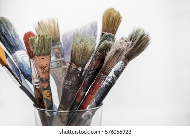 Close-up Of Old Paint Brushes, White Background