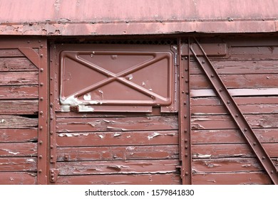 A close-up of an old train wagon which is out of order
