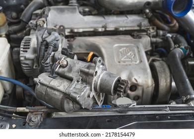 Close-up Of An Old Used Car Starter Motor.