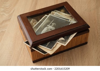 Close-up Old Vintage Photos 50s, 60s Sepia Color In Brown Wooden Box, Chest, Concept Of Antique Treasure, Family Tree, Genealogy, Memory Of Ancestors, Family Ties, Childhood Memories