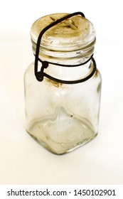 Closeup Of Old Vintage Worn Antique Mason Jar With Latch On Lid With Metal Rusted Latch