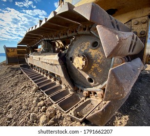 Closeup Of Old Yellow Bulldozer Treads