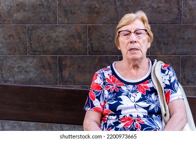 Close-up, Older Woman Sleeping Sitting On A Bench.