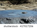 Closeup on an active muddy volcano cone with mud bubbles coming out