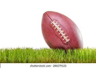 Close-up On An American Football On A Grass Surface Isolated On White Background